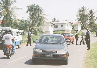 Police on alert on the Railway Embankment Road in the vicinity of Blyzeight Gardens where one of the cars was abandoned.